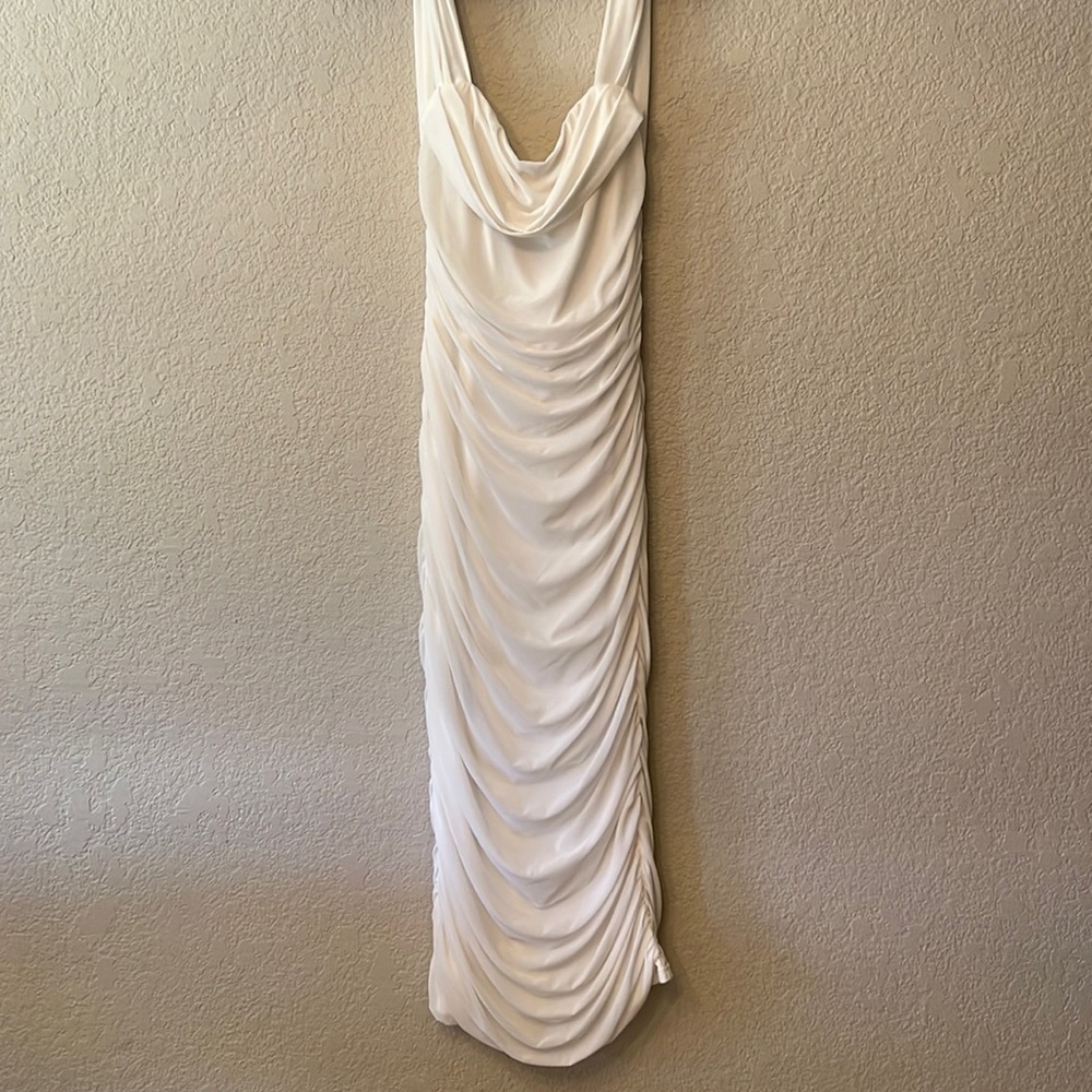 Ruched body con white strapless dress with off the shoulder straps.